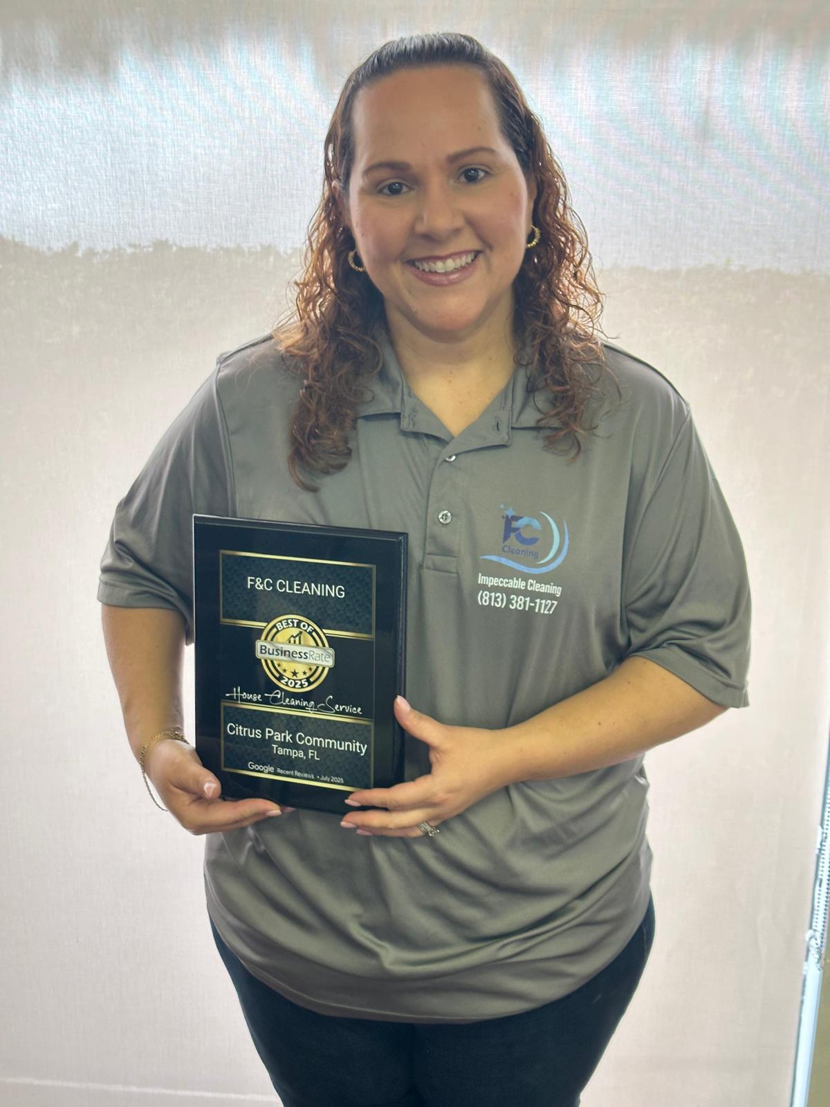 F&C Cleaning owner holding the 2025 Best of BusinessRate House Cleaning Service award for Citrus Park Community, Tampa FL