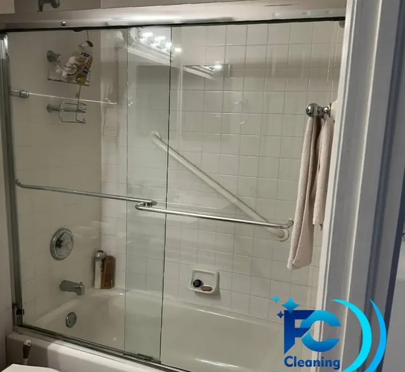 Clean tub and shower enclosure with spotless glass