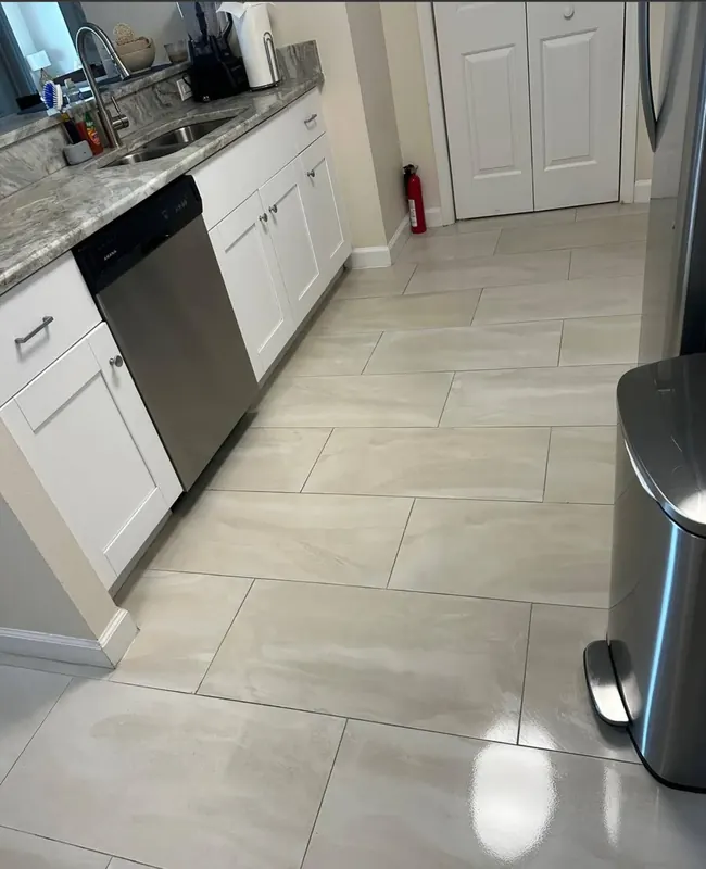 Gleaming kitchen tile floor after professional mopping