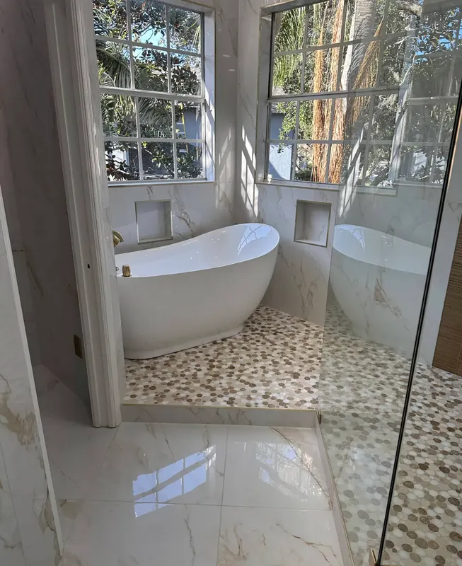 Elegant marble bathroom with freestanding soaking tub
